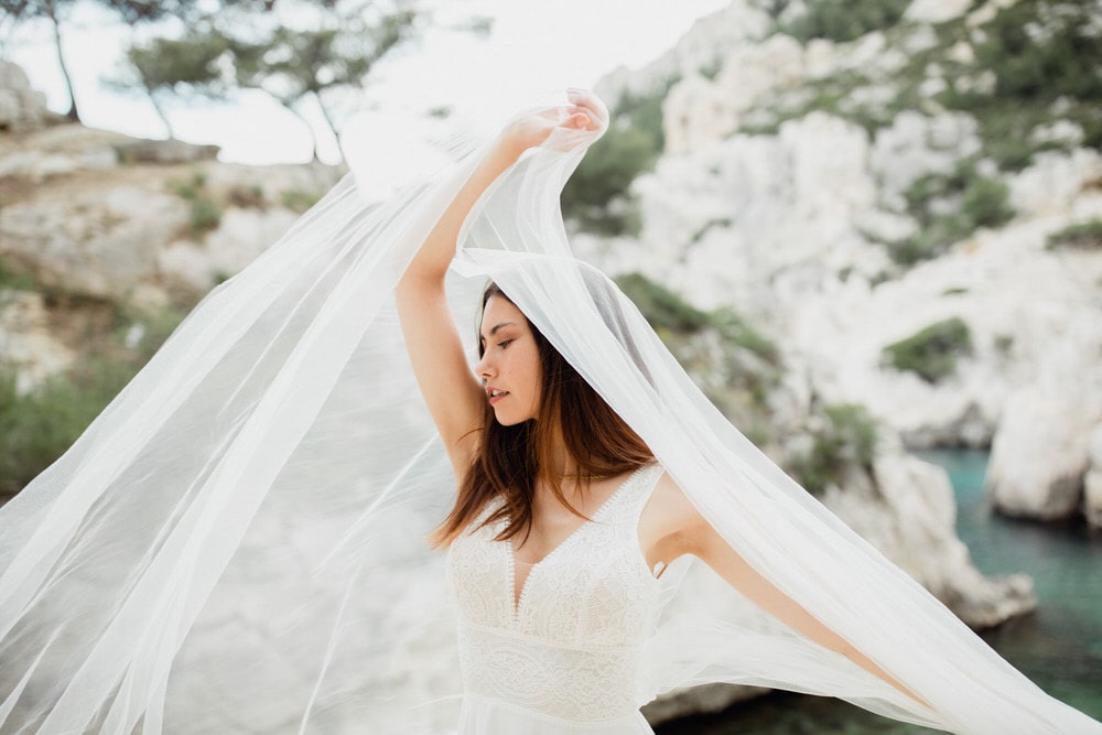 a bride play with her veil in french riviera
