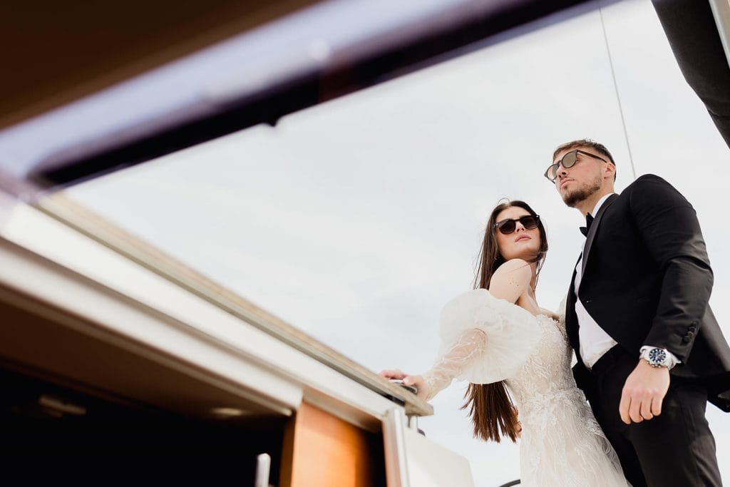 Bride and groom on a boat at a French riviera wedding