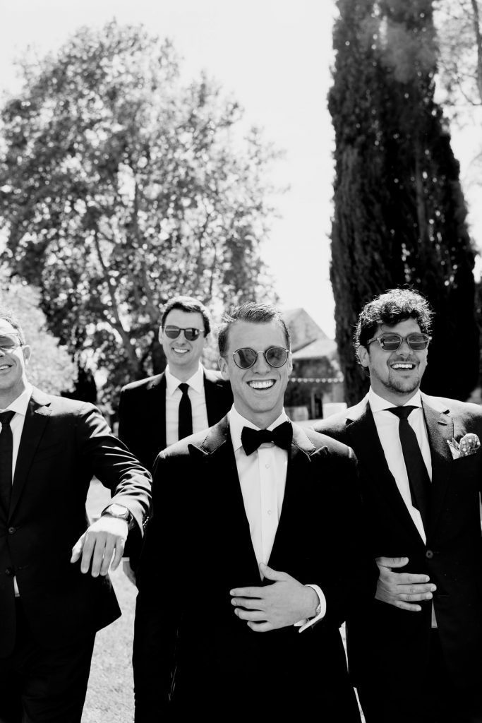 Château de Berne Photo of the groom walking with his groomsmen.