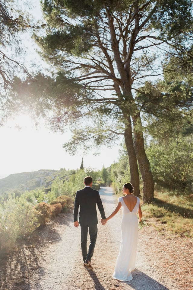 the married couple walking in the Abbaye de Sainte Croix